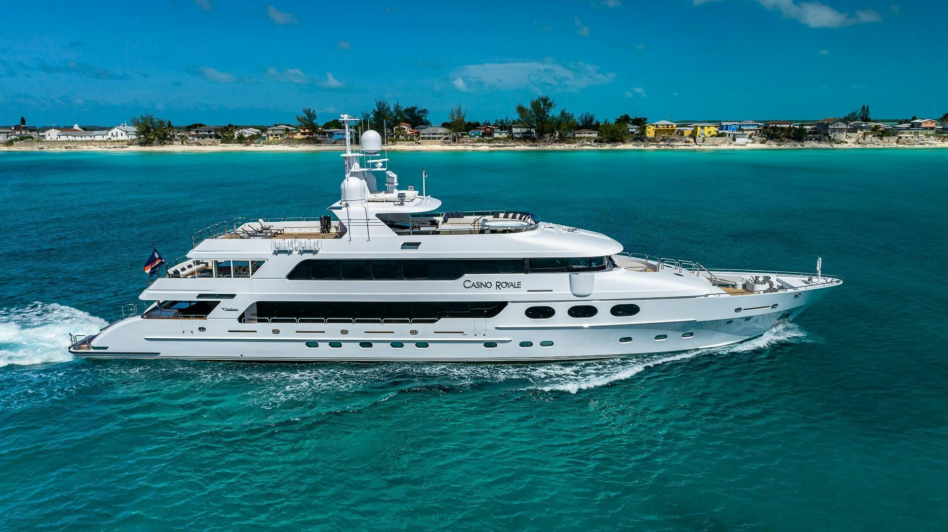 a white yacht in the water aboard CASINO ROYALE Yacht for Sale