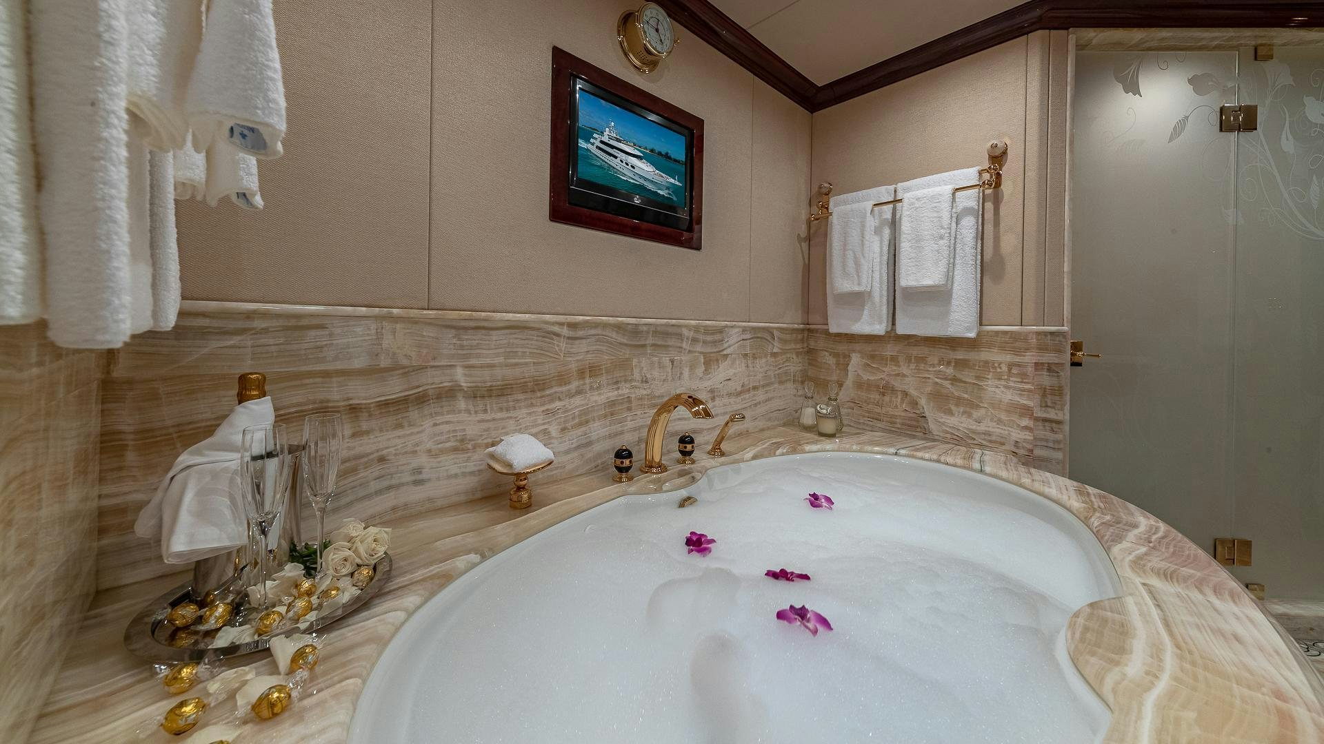 a bathroom with a large bathtub aboard CASINO ROYALE Yacht for Sale