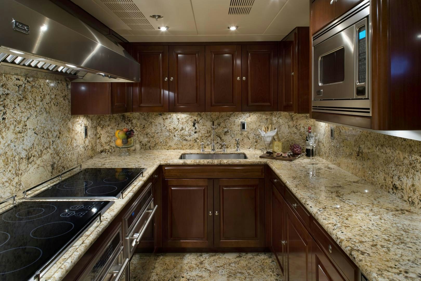 a kitchen with granite counter tops aboard CASINO ROYALE Yacht for Sale