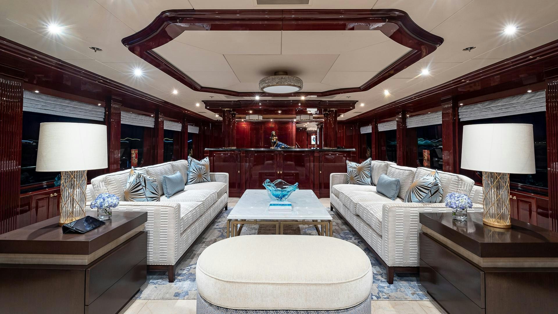 a living room with a large mirror aboard CASINO ROYALE Yacht for Sale