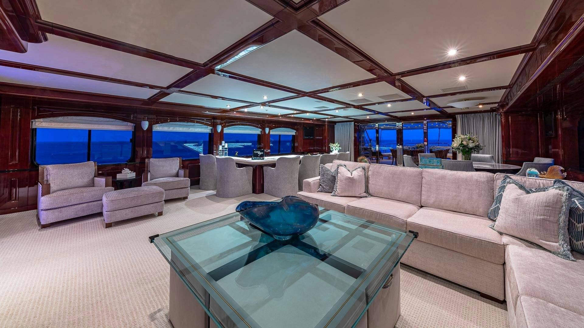 a living room with a large swimming pool aboard CASINO ROYALE Yacht for Sale