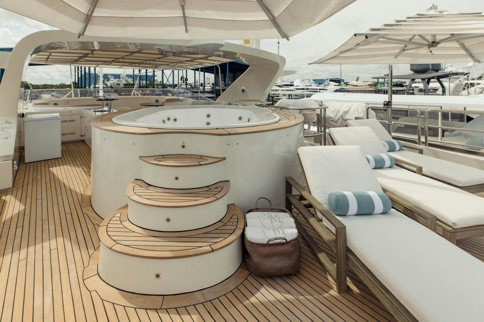 a large room with a large white tub and a large white bed aboard MAMMA MIA Yacht for Sale