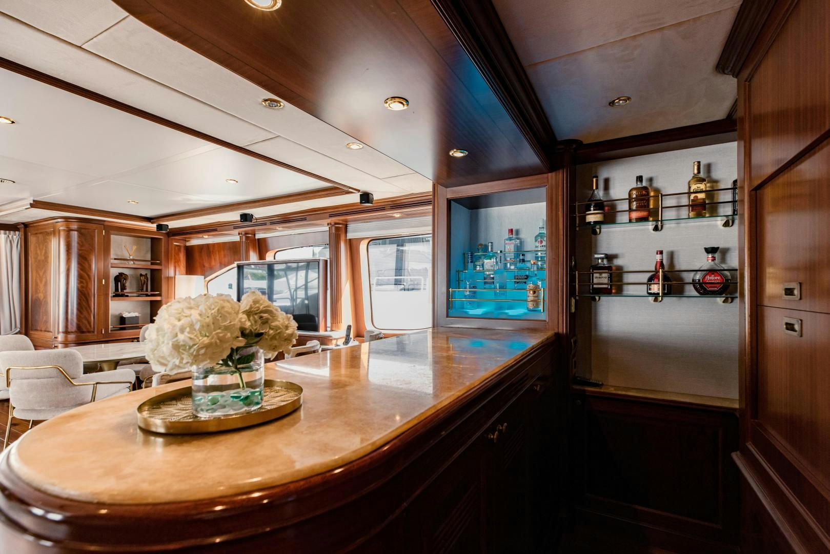 a kitchen with a bar and a table aboard MAMMA MIA Yacht for Sale