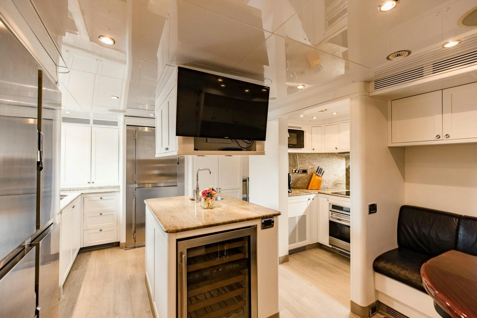 a kitchen with a large island aboard MAMMA MIA Yacht for Sale