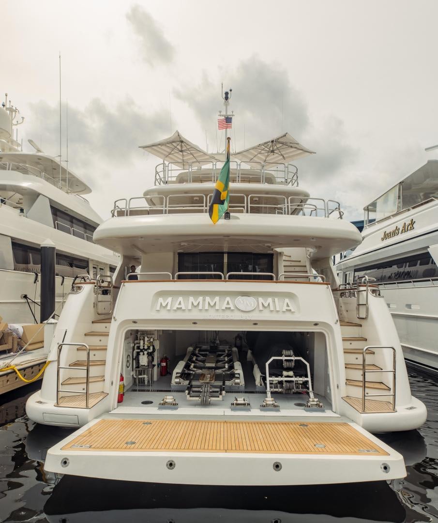 a boat with a flag on the front aboard MAMMA MIA Yacht for Sale