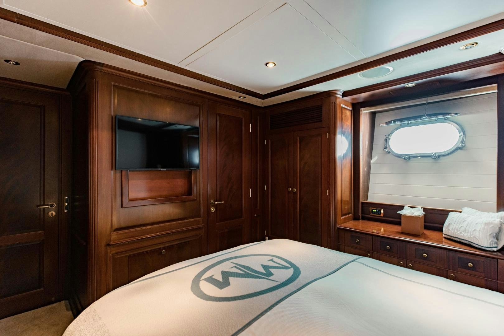 a bedroom with a bed and a television aboard MAMMA MIA Yacht for Sale