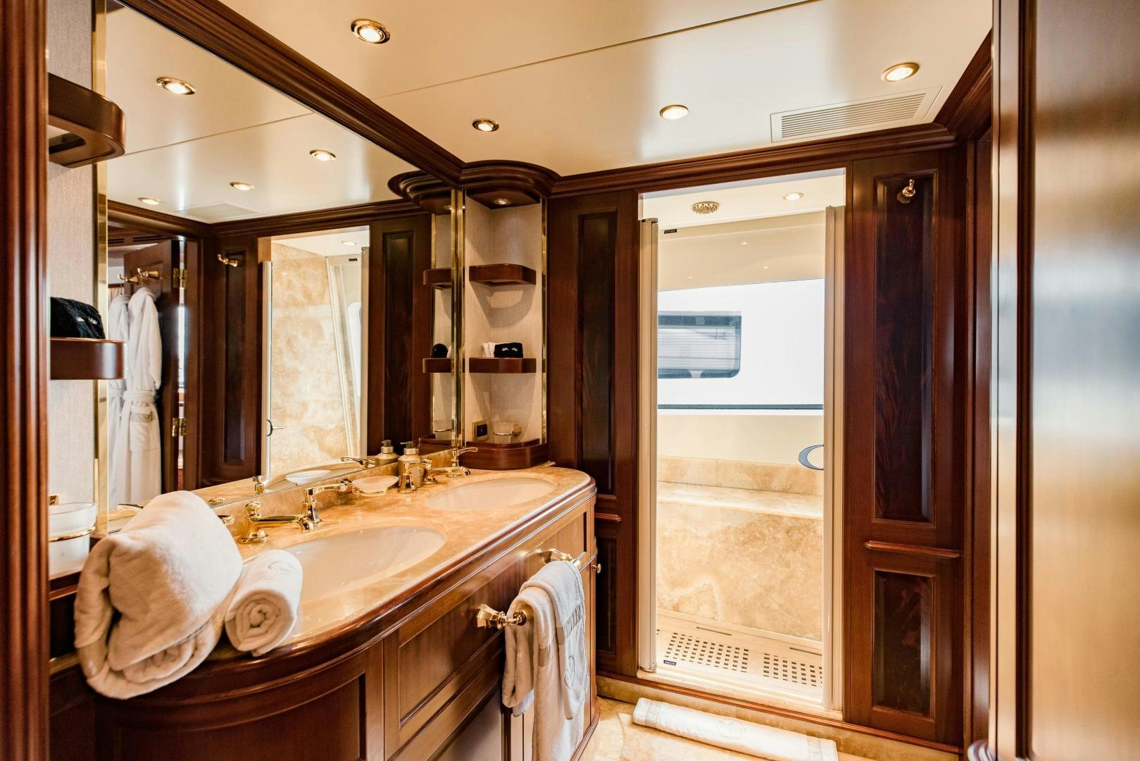 a bathroom with a large mirror aboard MAMMA MIA Yacht for Sale