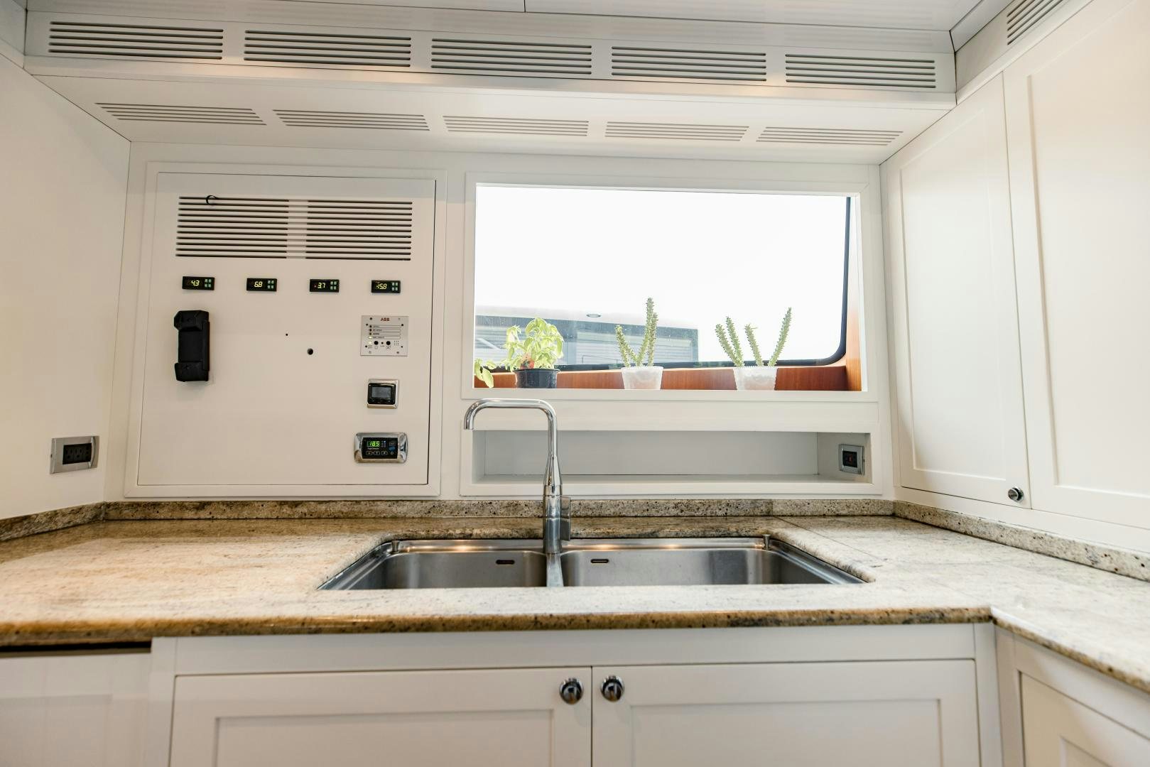 a kitchen with a sink and cabinets aboard MAMMA MIA Yacht for Sale
