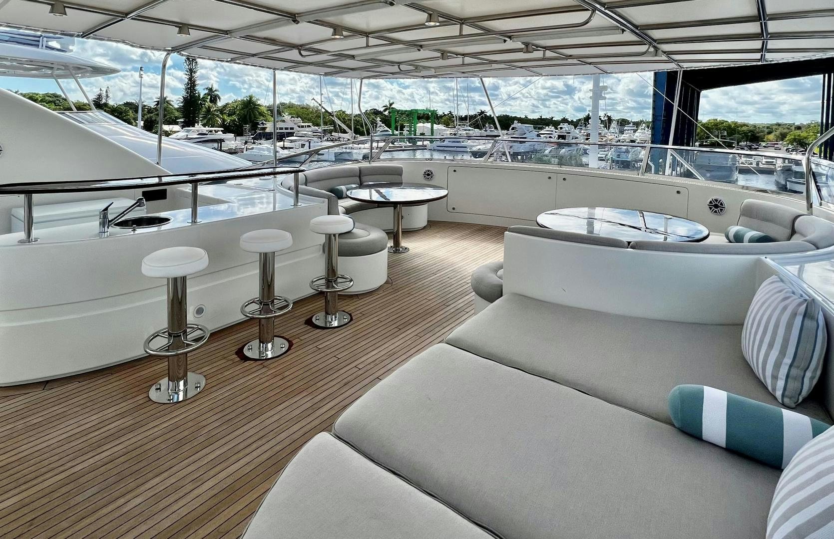 a room with a large white lounge chair and a large window aboard MAMMA MIA Yacht for Sale