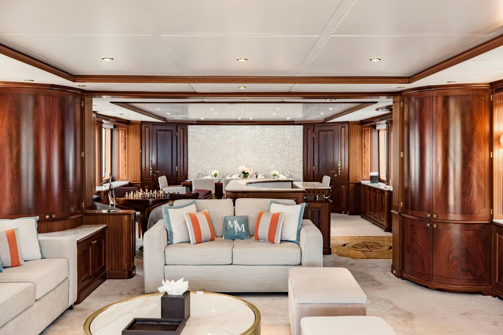 a living room with a couch and a table aboard MAMMA MIA Yacht for Sale