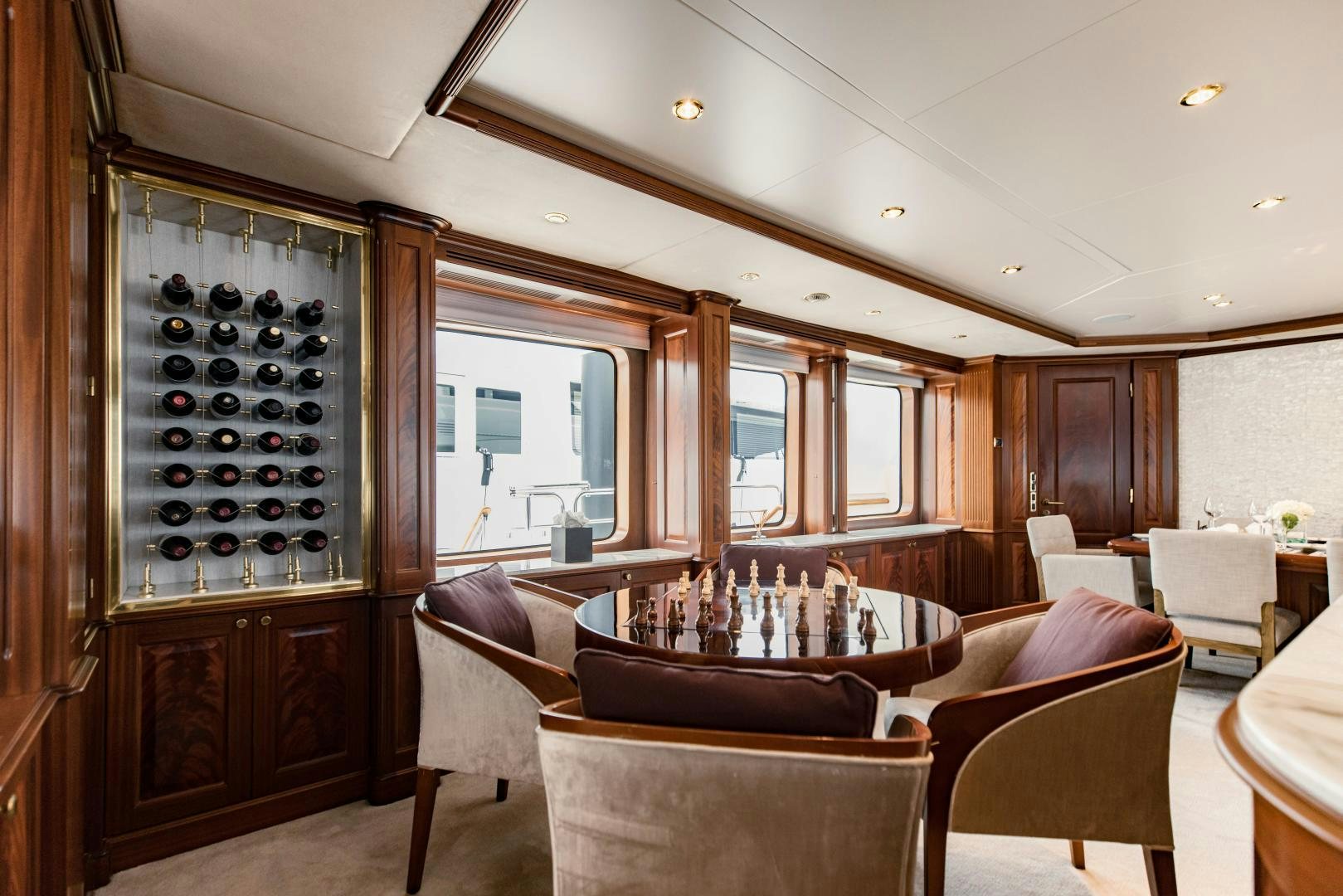 a living room with a wood cabinet aboard MAMMA MIA Yacht for Sale