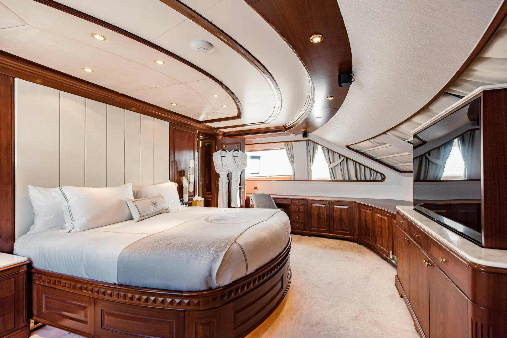 a large bedroom with a large bed aboard MAMMA MIA Yacht for Sale