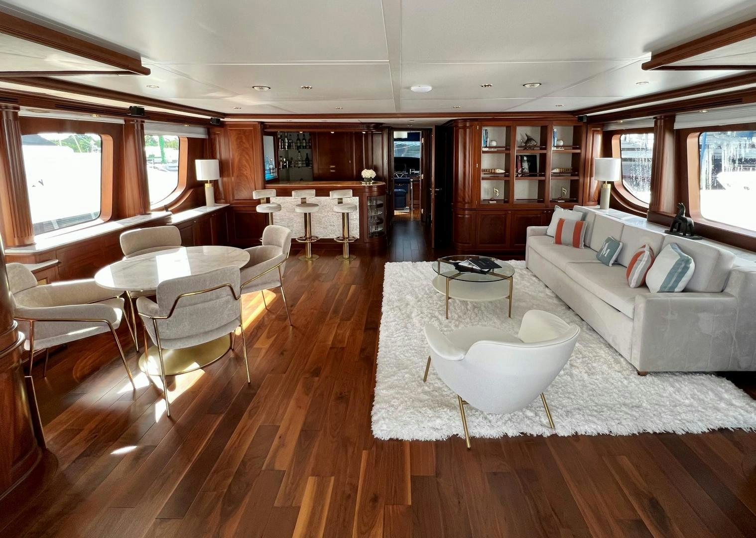 a living room with a couch and a table aboard MAMMA MIA Yacht for Sale