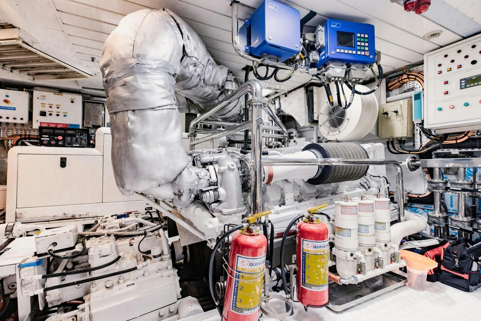 a person in a white suit working in a laboratory aboard MAMMA MIA Yacht for Sale