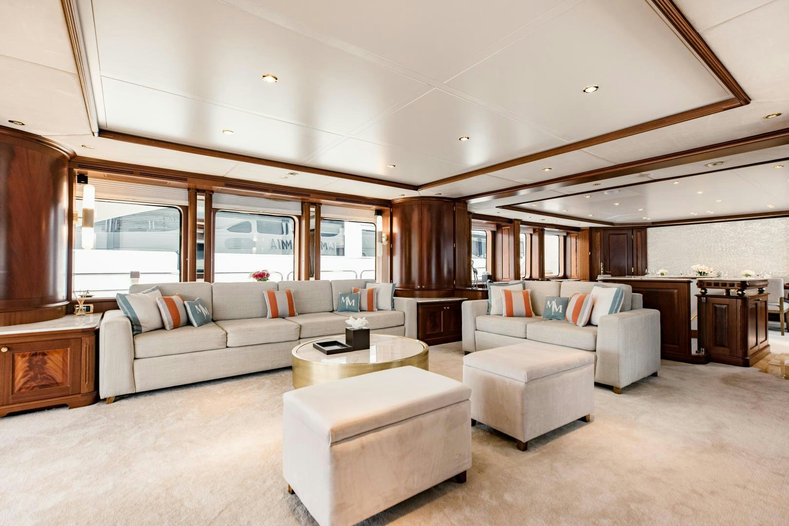 a living room with a large wood fireplace aboard MAMMA MIA Yacht for Sale