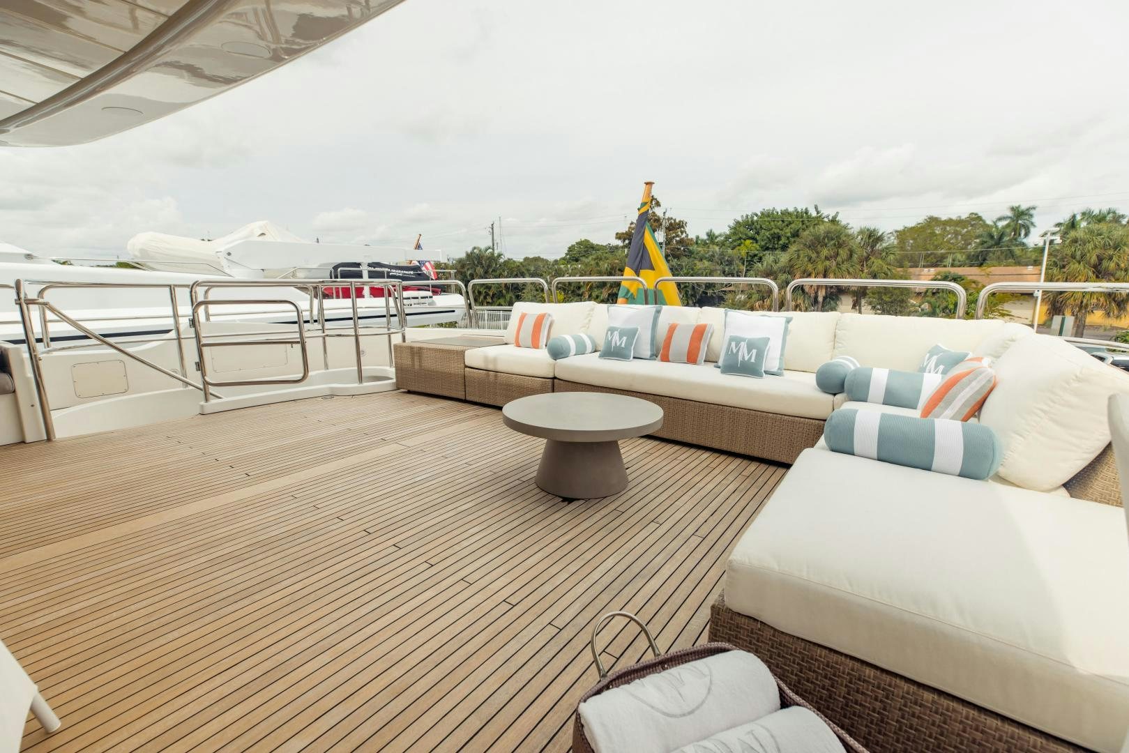 a deck with a couch and a pool aboard MAMMA MIA Yacht for Sale