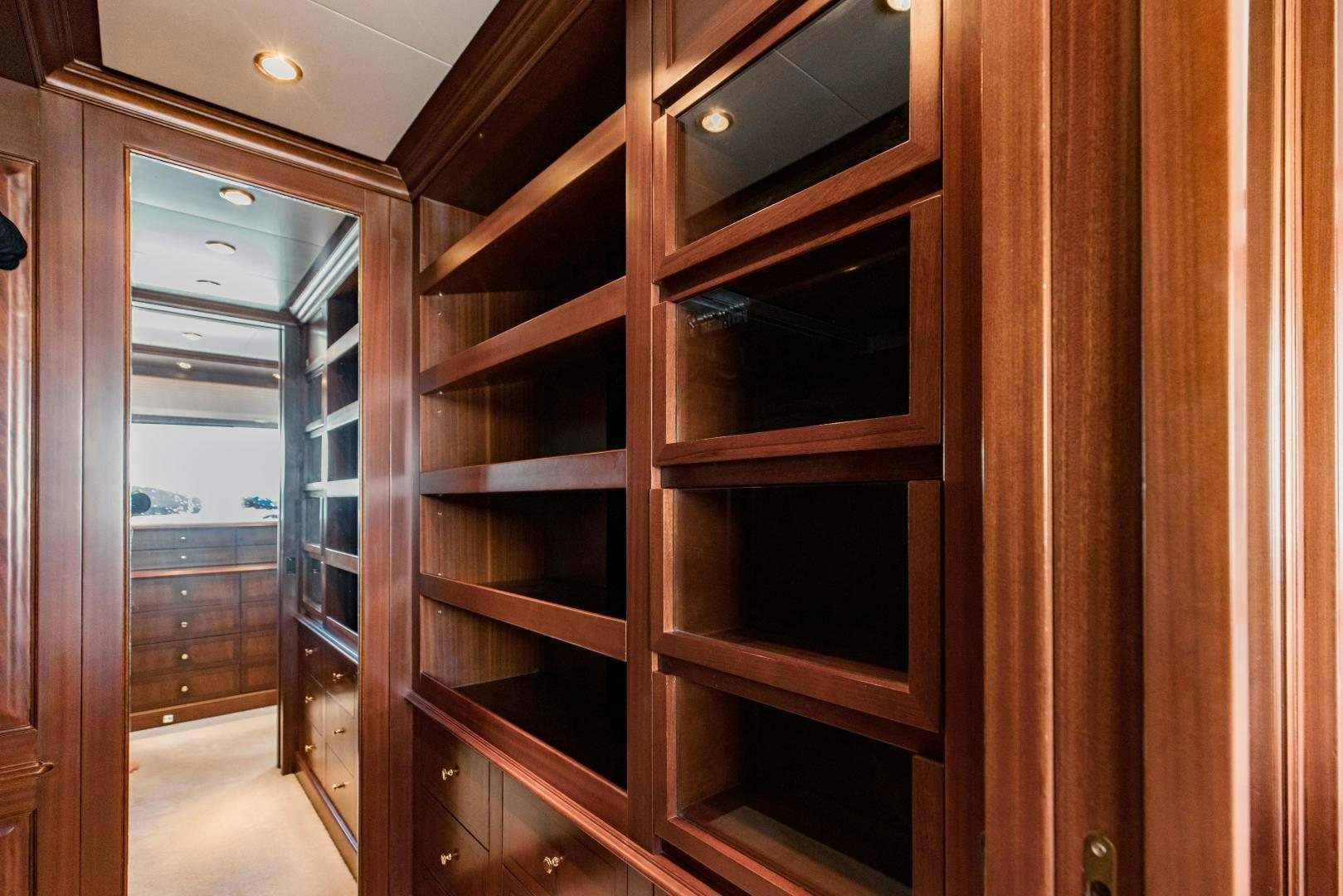 a room with wooden cabinets aboard MAMMA MIA Yacht for Sale