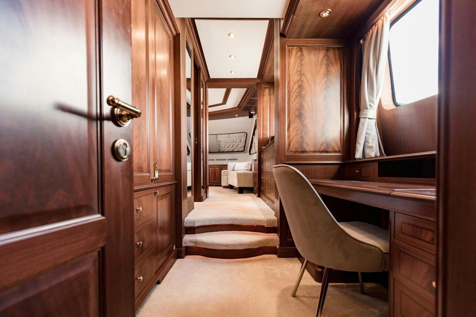 a room with a desk and a chair aboard MAMMA MIA Yacht for Sale