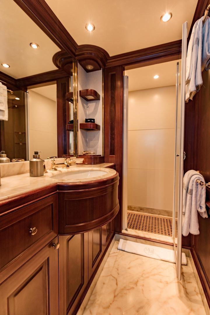 a bathroom with a sink and a mirror aboard MAMMA MIA Yacht for Sale