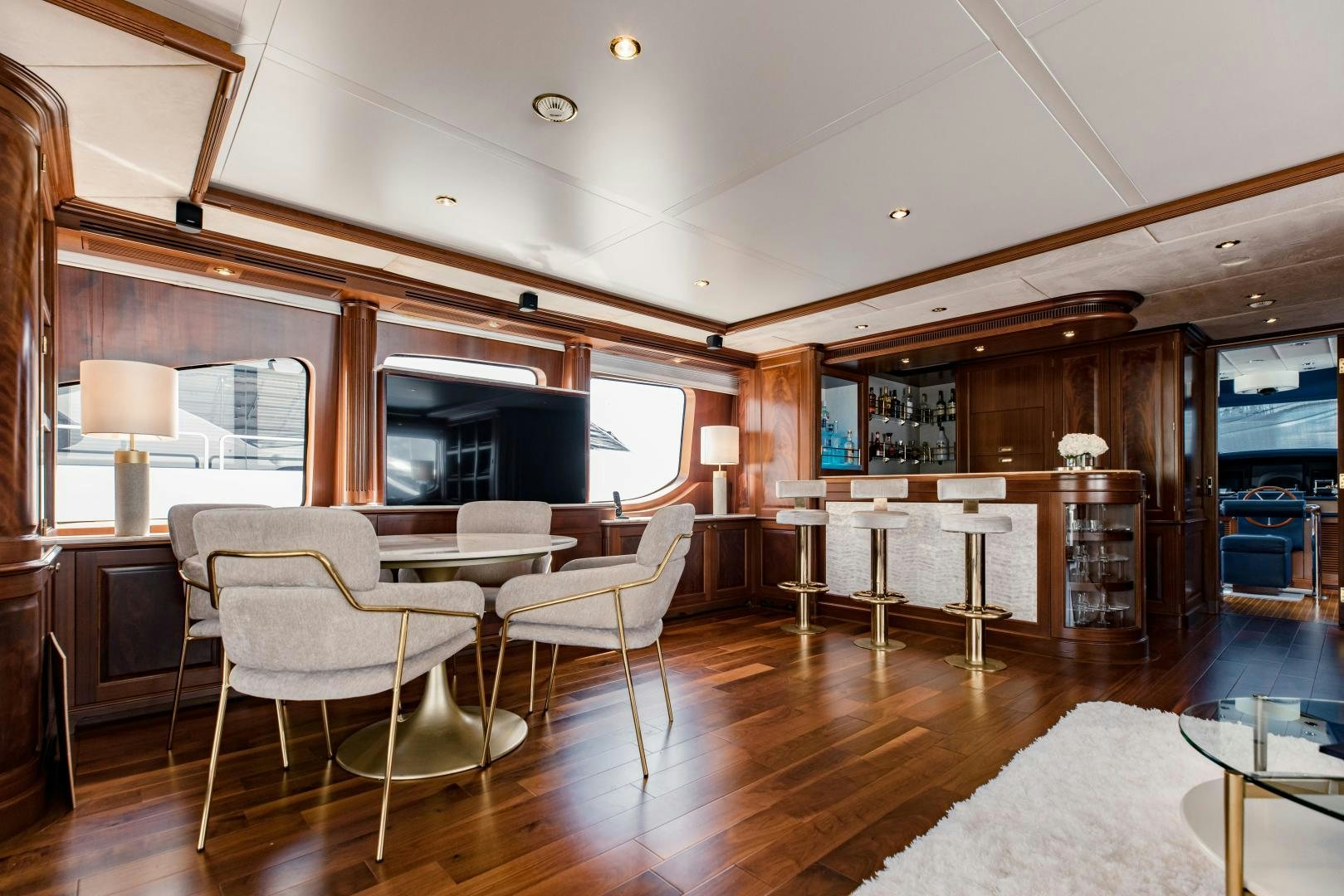 a large living room with wood floors aboard MAMMA MIA Yacht for Sale