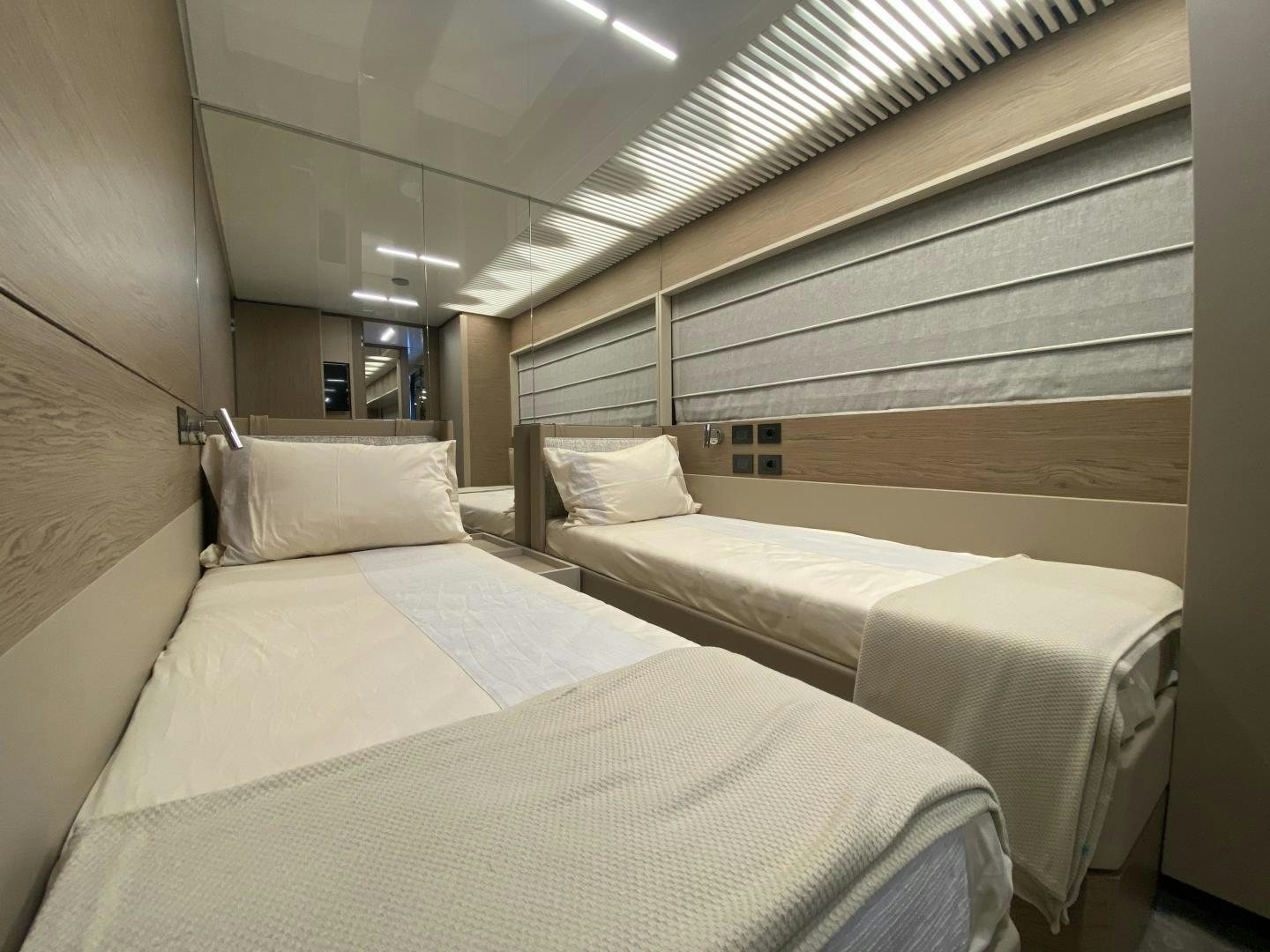 a room with beds in it aboard M/Y SUNRISE Yacht for Sale