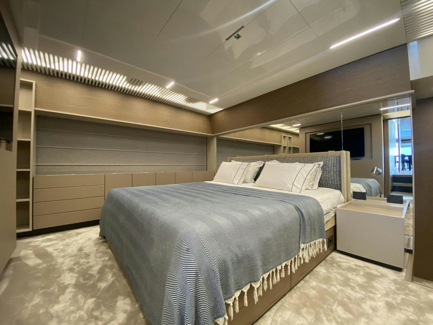 a room with a bed and a television aboard M/Y SUNRISE Yacht for Sale