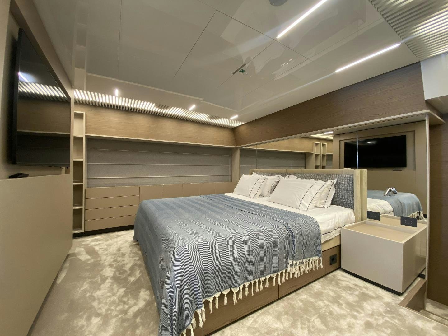a room with a bed and a window aboard M/Y SUNRISE Yacht for Sale
