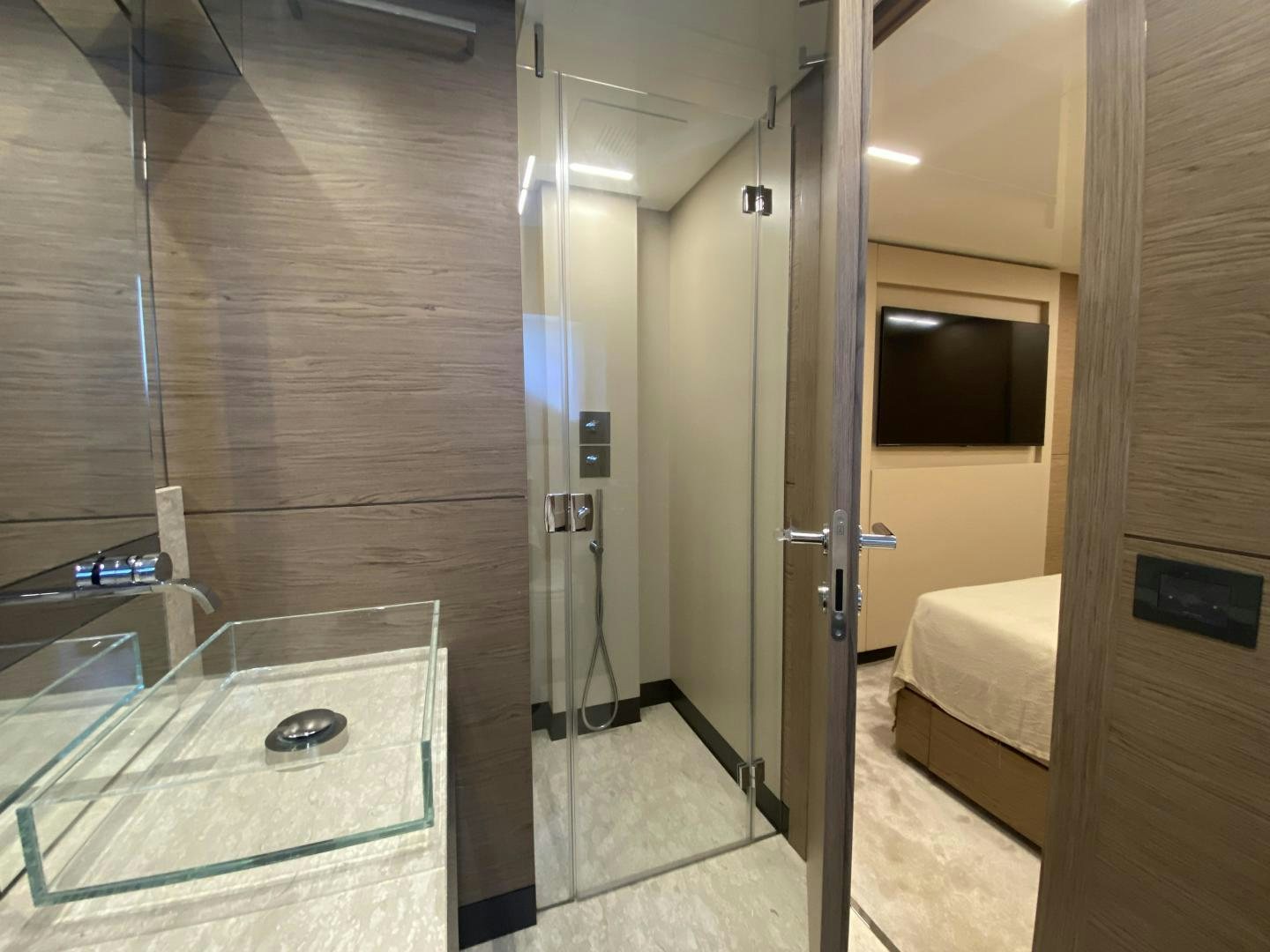 a bathroom with a glass shower aboard M/Y SUNRISE Yacht for Sale