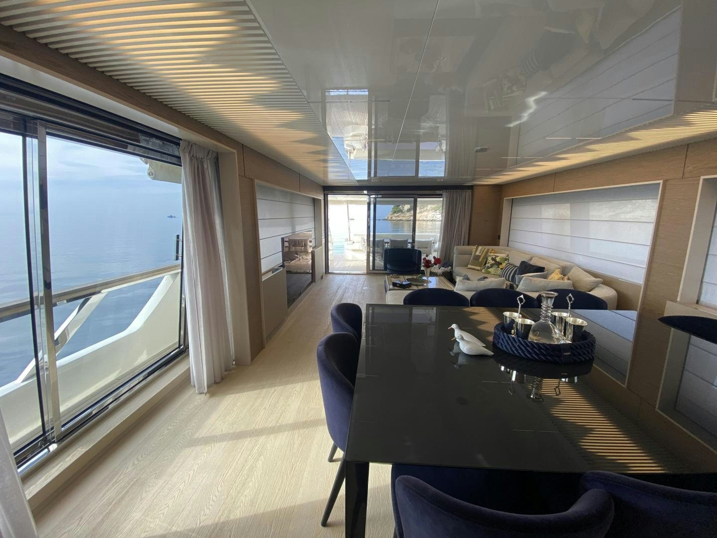 a room with a table and chairs aboard M/Y SUNRISE Yacht for Sale
