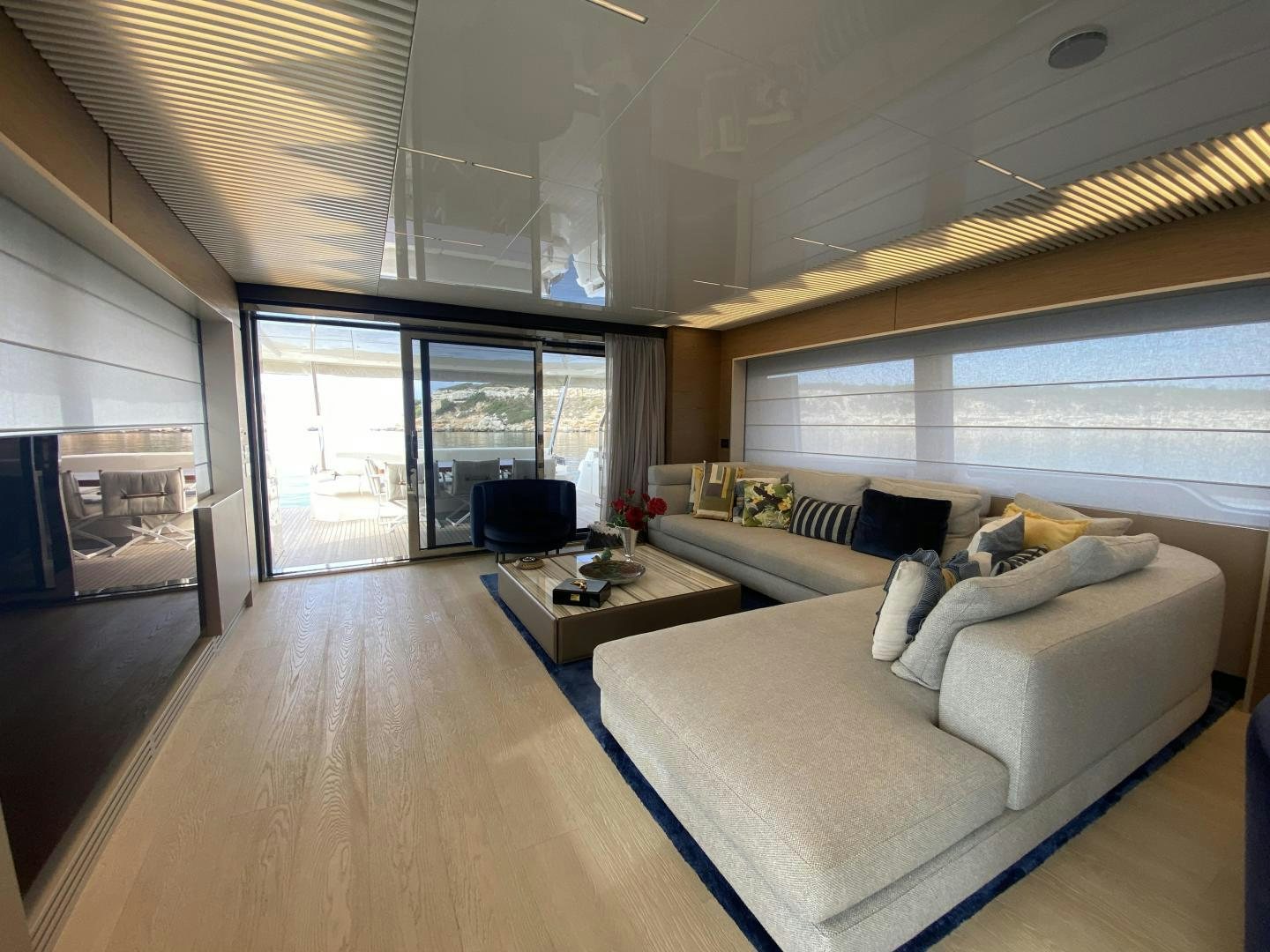 a living room with a large window aboard M/Y SUNRISE Yacht for Sale