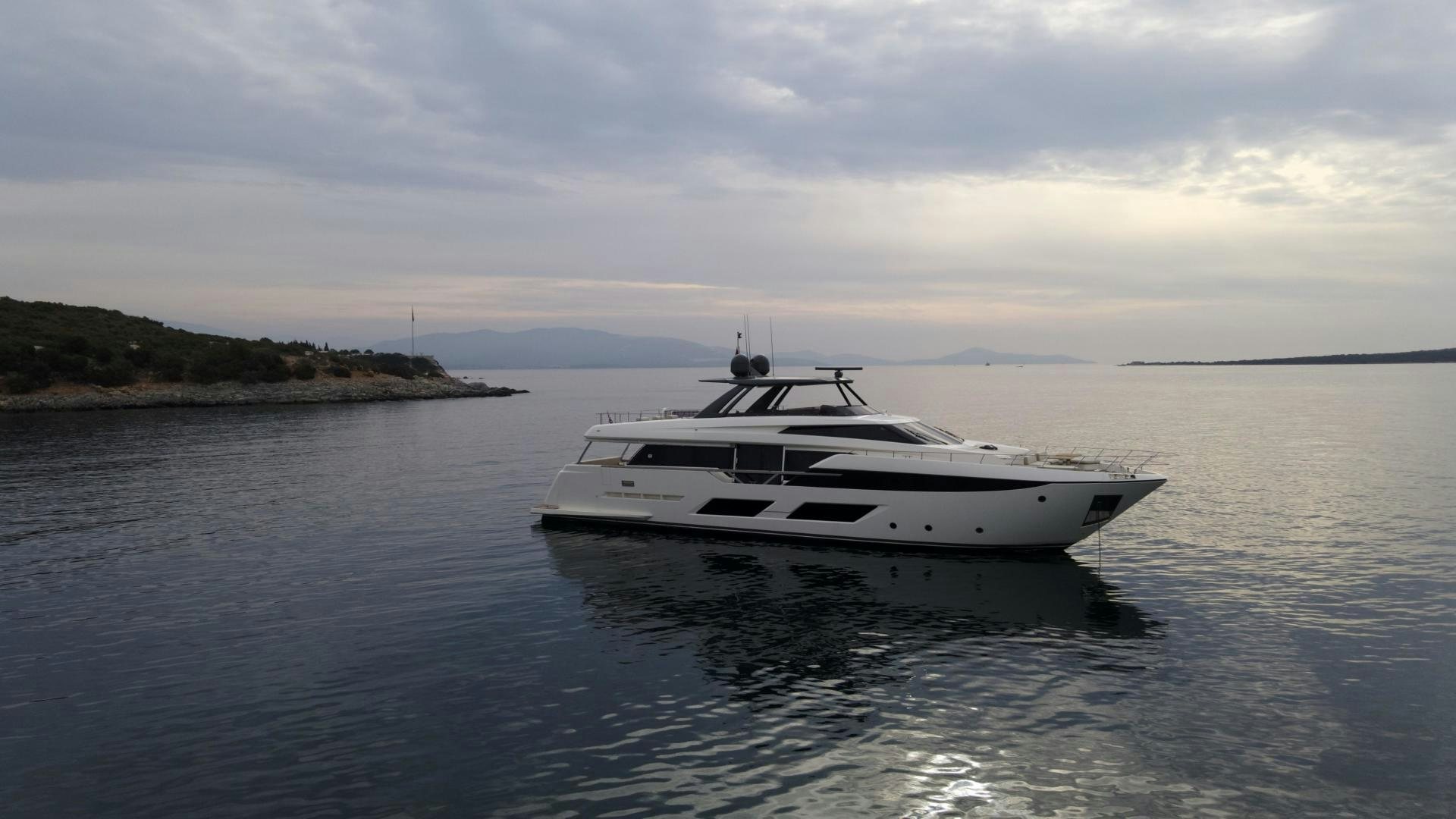 a white boat in the water aboard M/Y SUNRISE Yacht for Sale