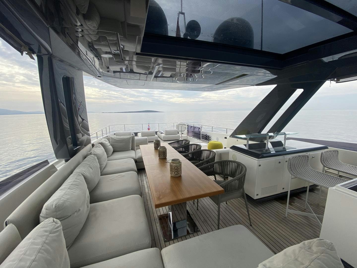 a room with a couch and a table aboard M/Y SUNRISE Yacht for Sale