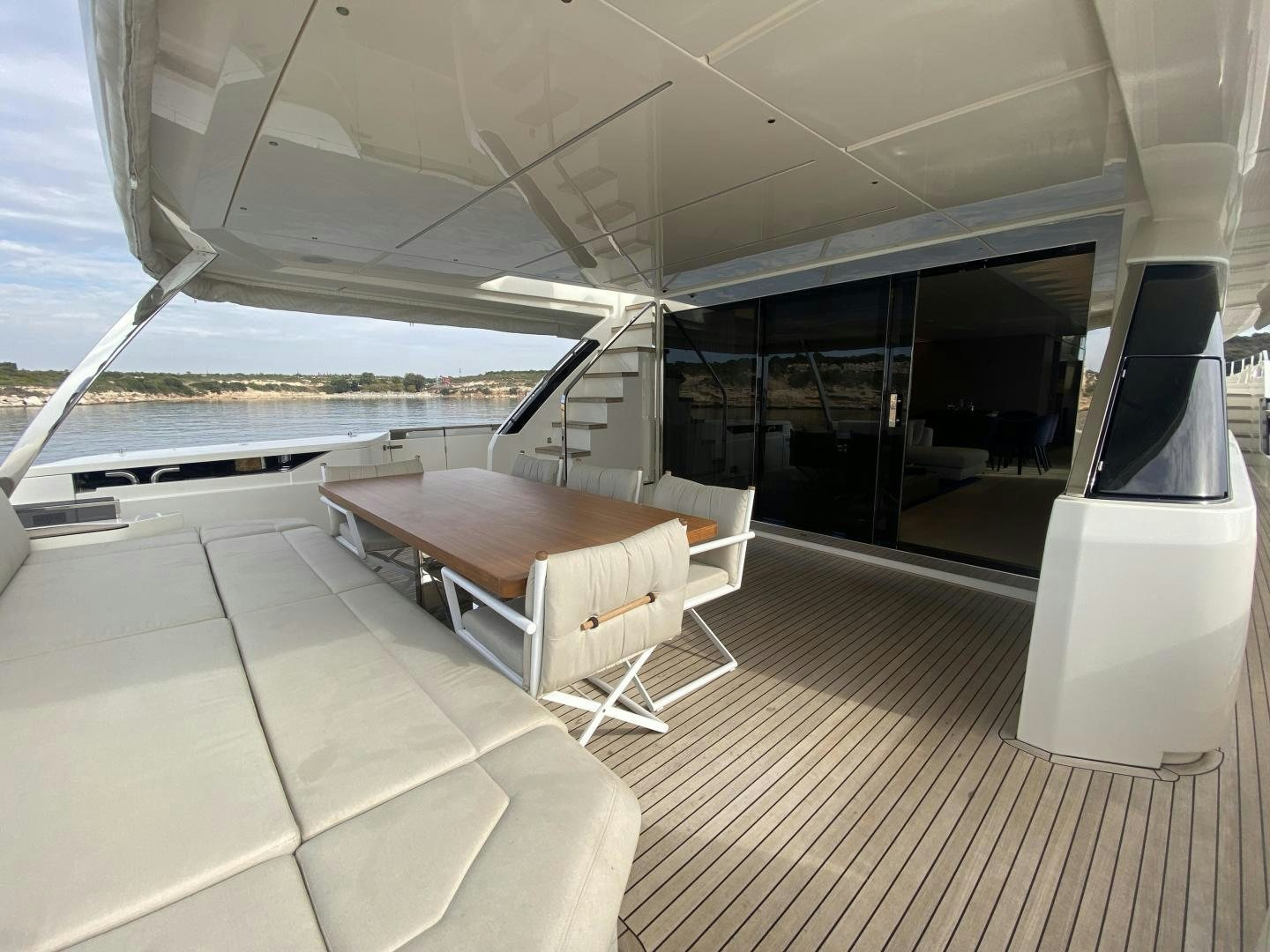 a room with a table and chairs aboard M/Y SUNRISE Yacht for Sale