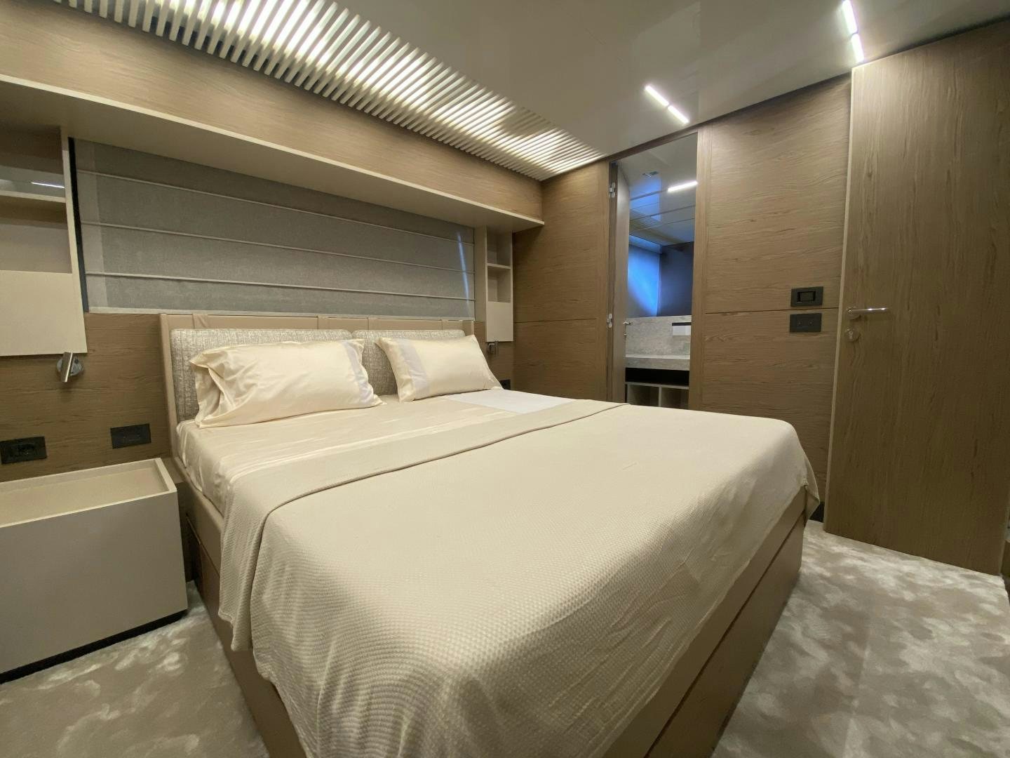 a bed in a room aboard M/Y SUNRISE Yacht for Sale