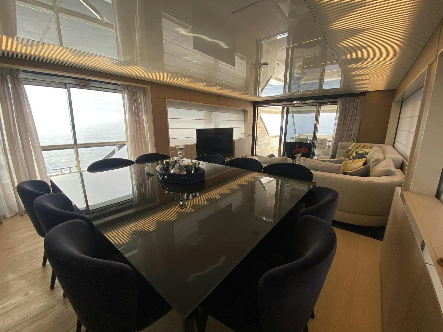 a large room with a table and chairs aboard M/Y SUNRISE Yacht for Sale