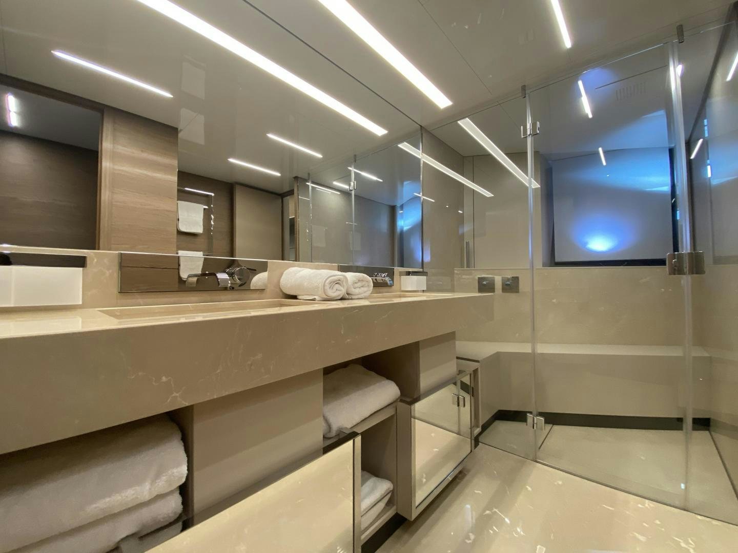 a bathroom with a countertop sink and a window aboard M/Y SUNRISE Yacht for Sale