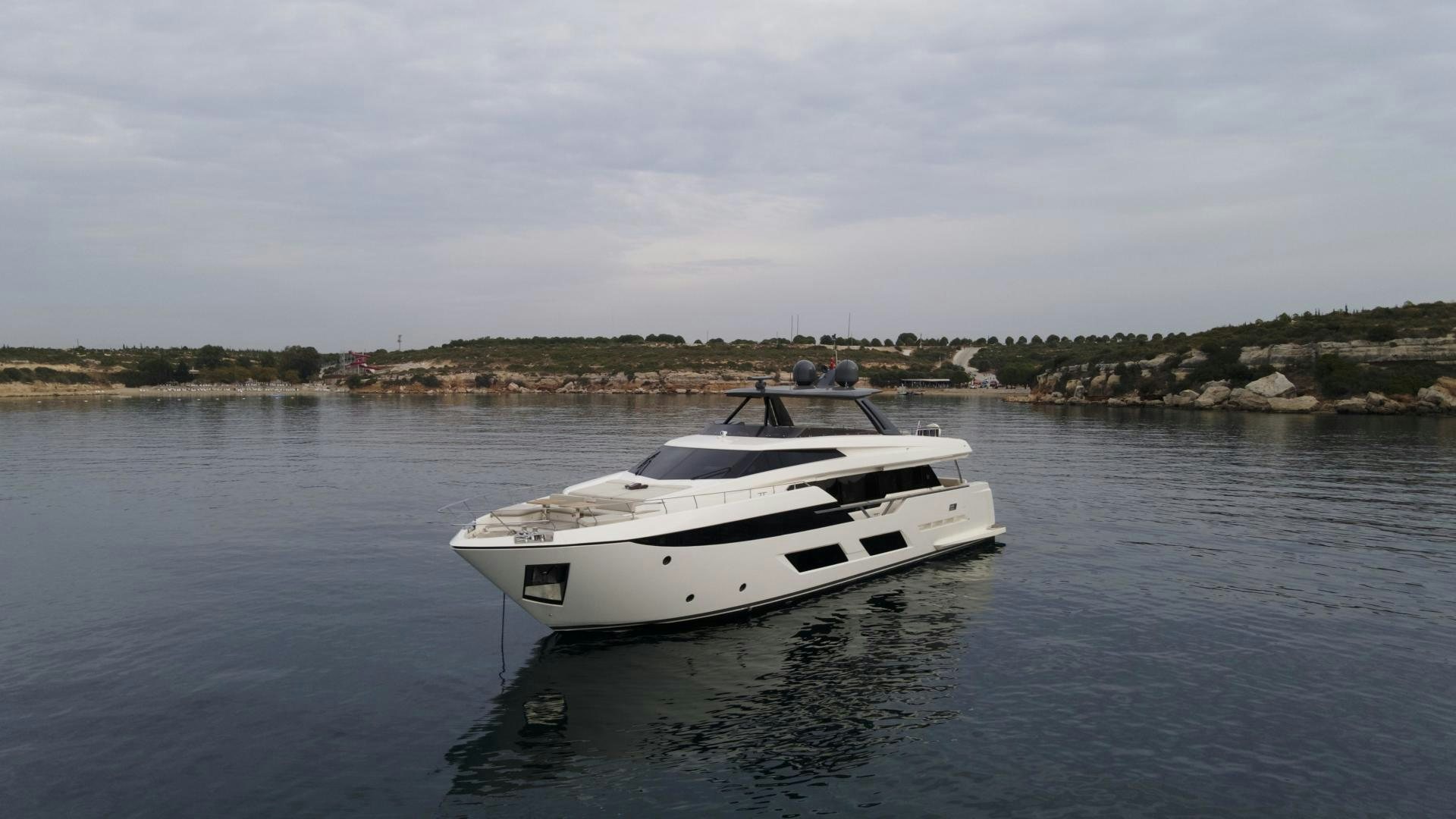 a white yacht in the water aboard M/Y SUNRISE Yacht for Sale