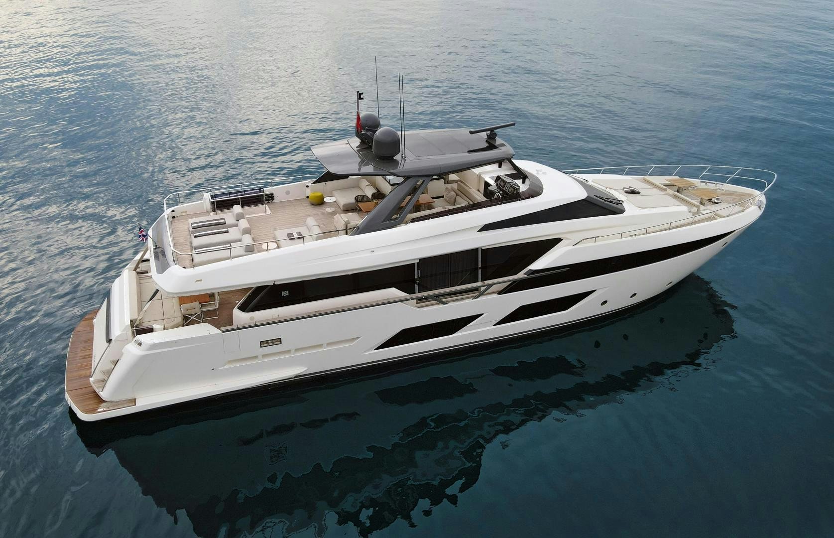 a white boat on the water aboard M/Y SUNRISE Yacht for Sale