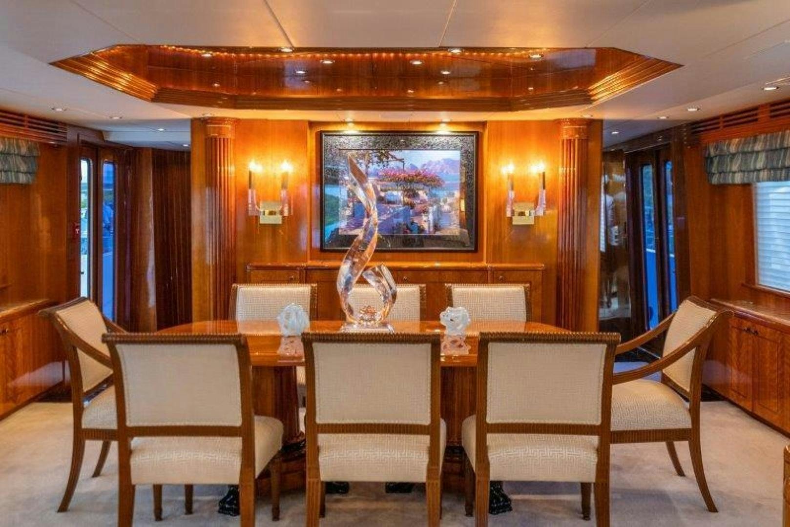 a room with a table and chairs aboard TIE BREAKER Yacht for Sale