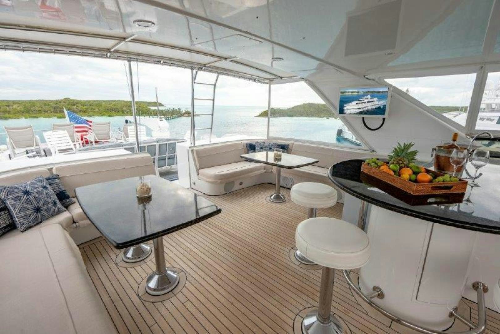 a room with a table and chairs aboard TIE BREAKER Yacht for Sale