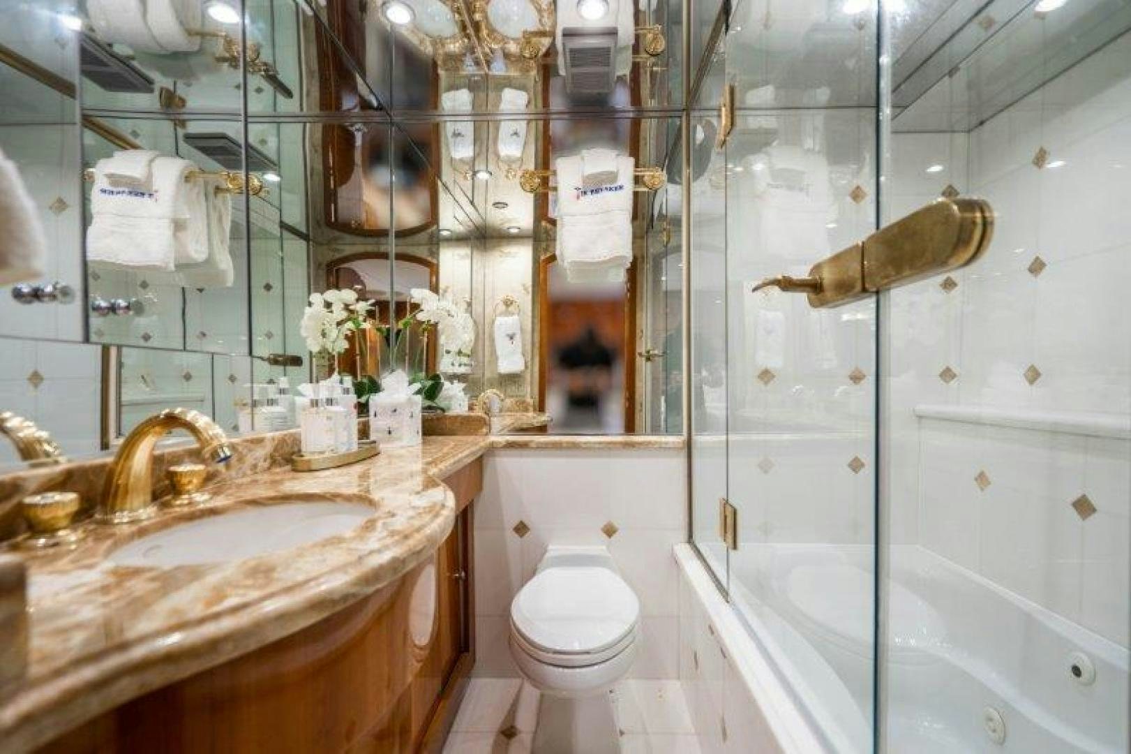 a bathroom with a sink toilet and bathtub aboard TIE BREAKER Yacht for Sale