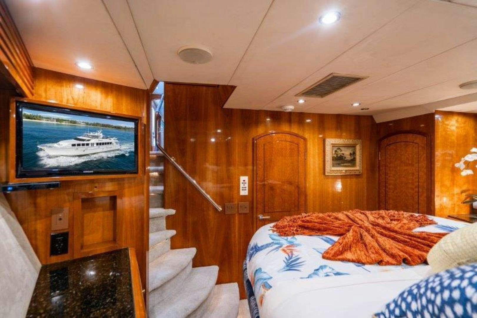 a bedroom with a tv on the wall aboard TIE BREAKER Yacht for Sale