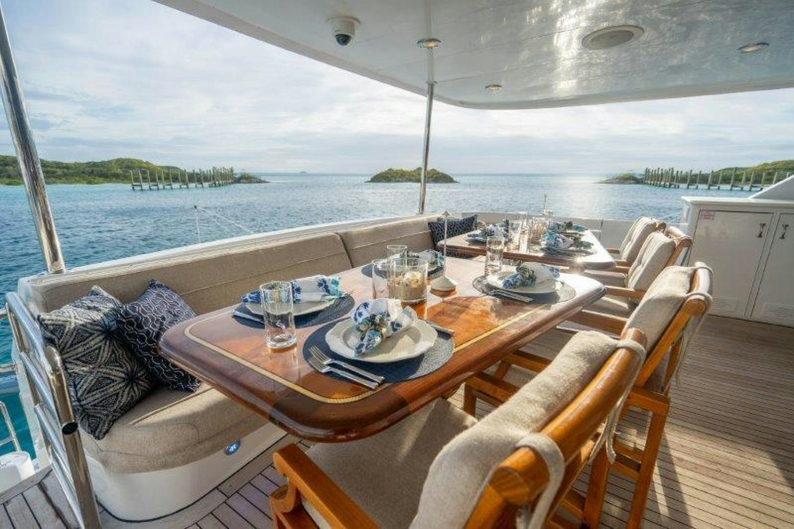 a table with plates and glasses on it aboard TIE BREAKER Yacht for Sale