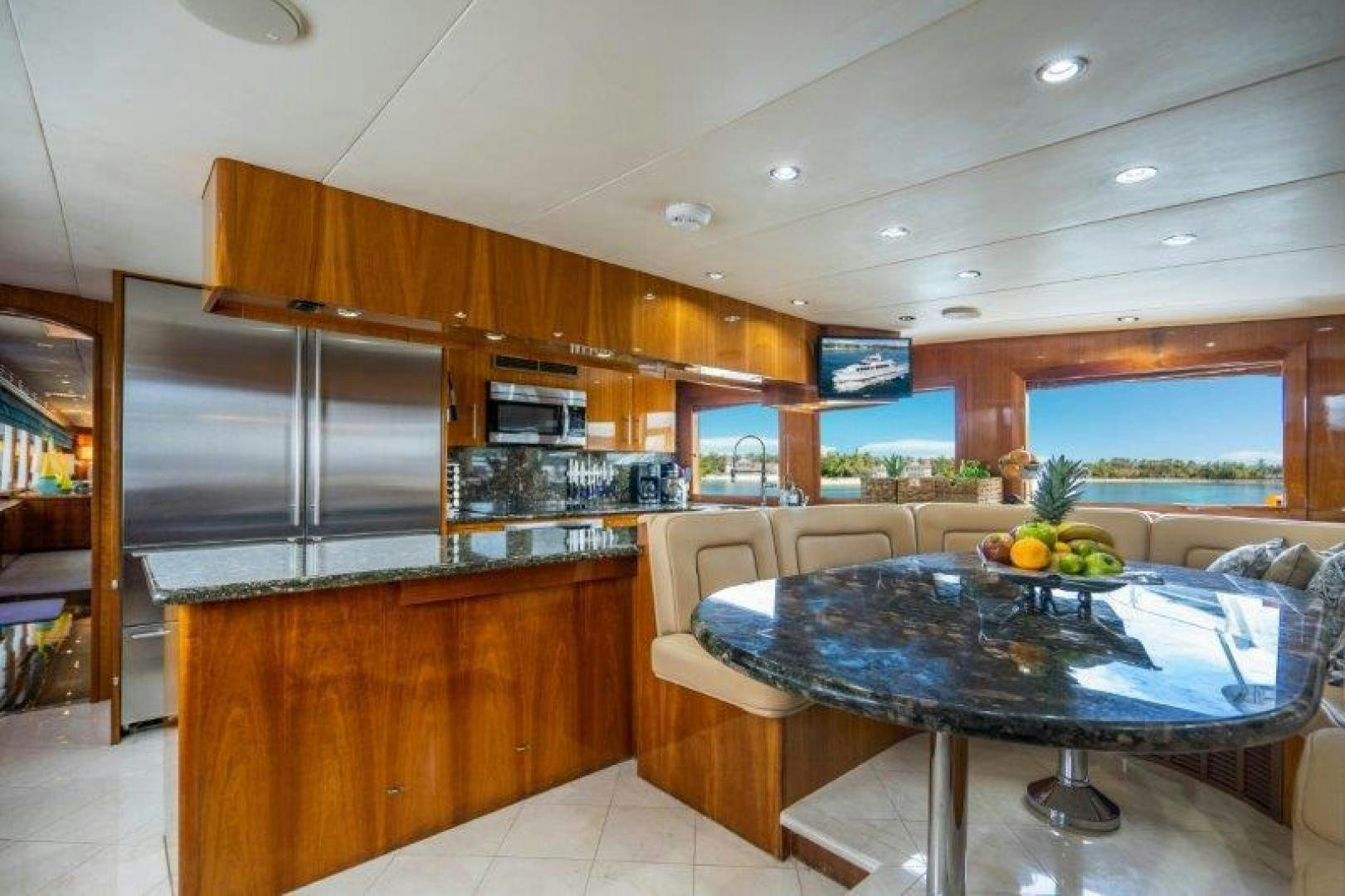 a kitchen with a table and chairs aboard TIE BREAKER Yacht for Sale