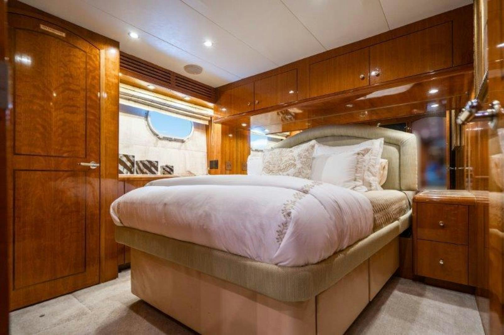 a room with a bed and a wood door aboard TIE BREAKER Yacht for Sale