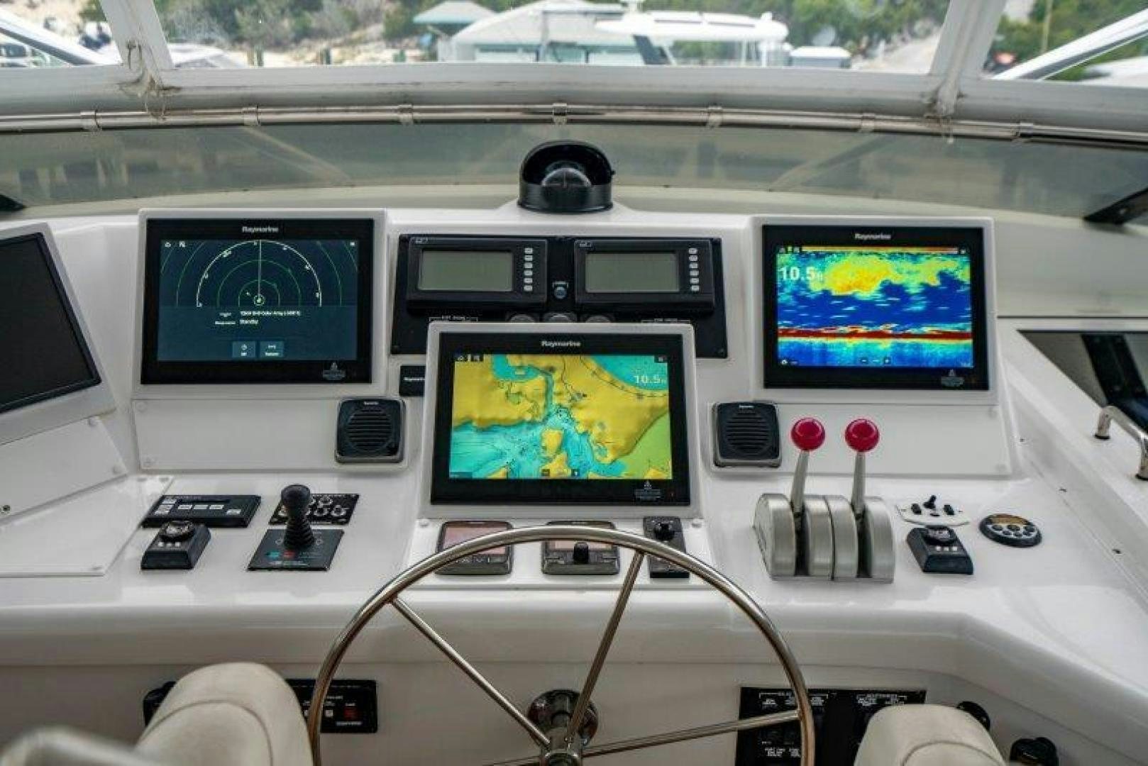 a control panel with multiple monitors aboard TIE BREAKER Yacht for Sale