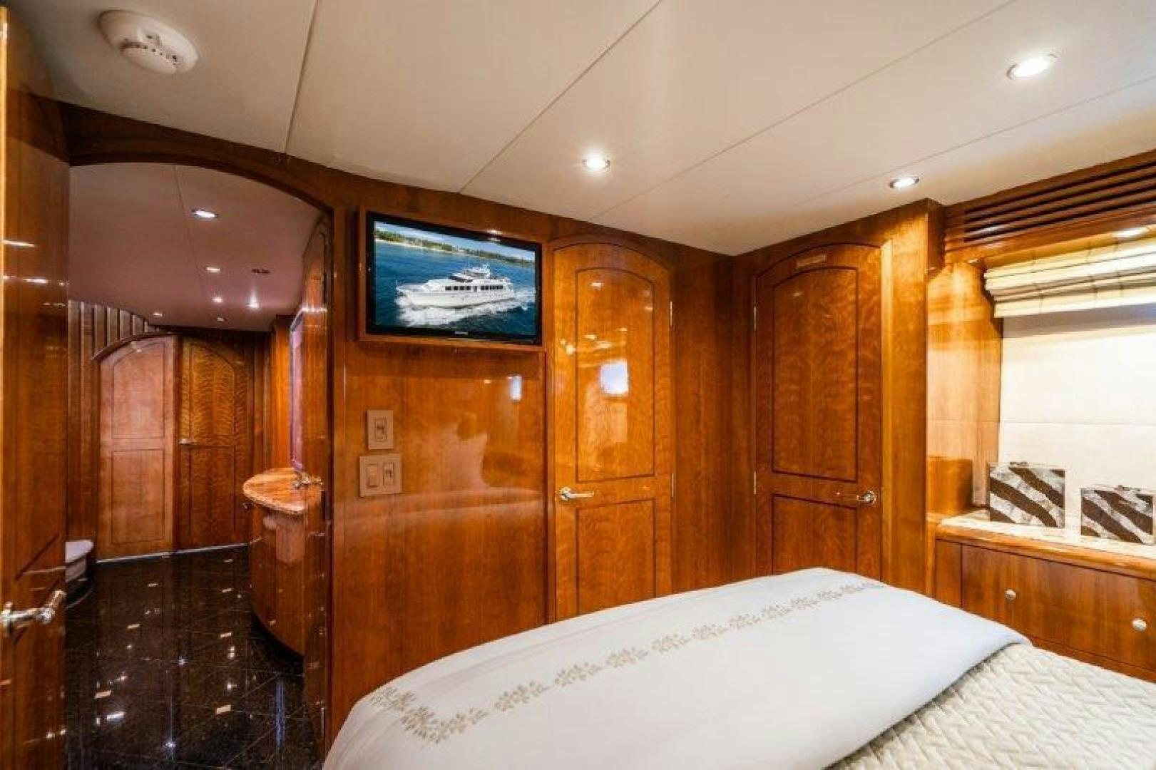 a bedroom with a tv on the wall aboard TIE BREAKER Yacht for Sale