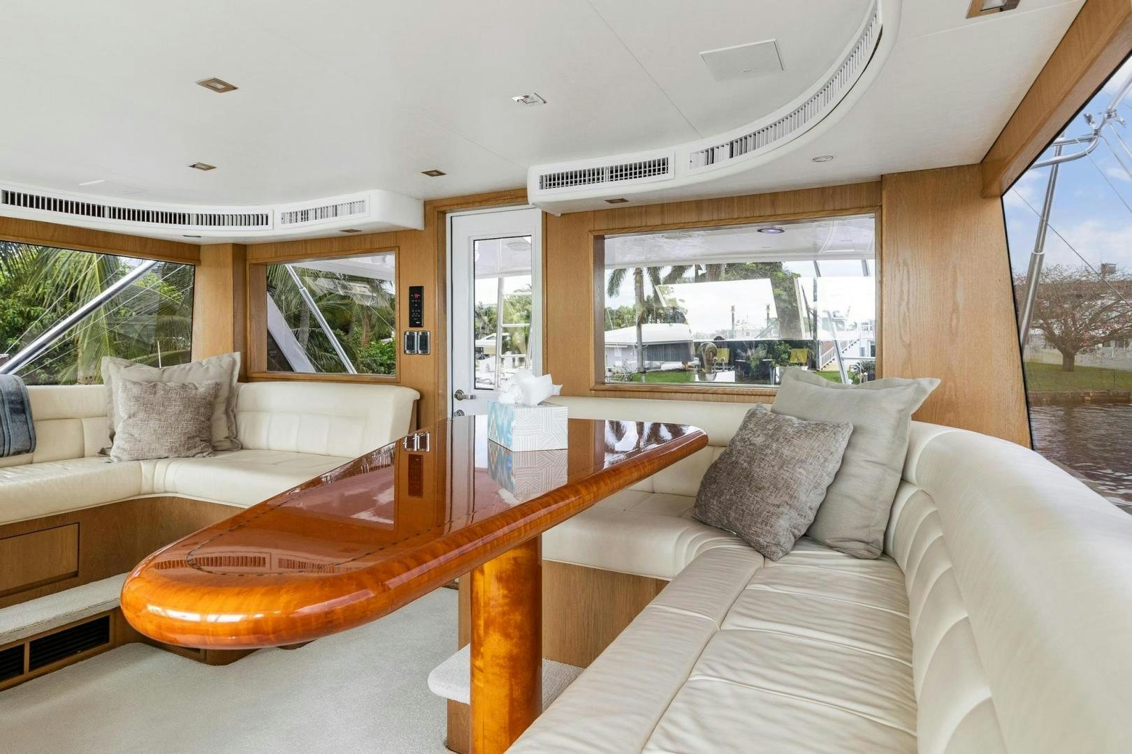 a living room with a table and couches aboard BELLISSIMA Yacht for Sale