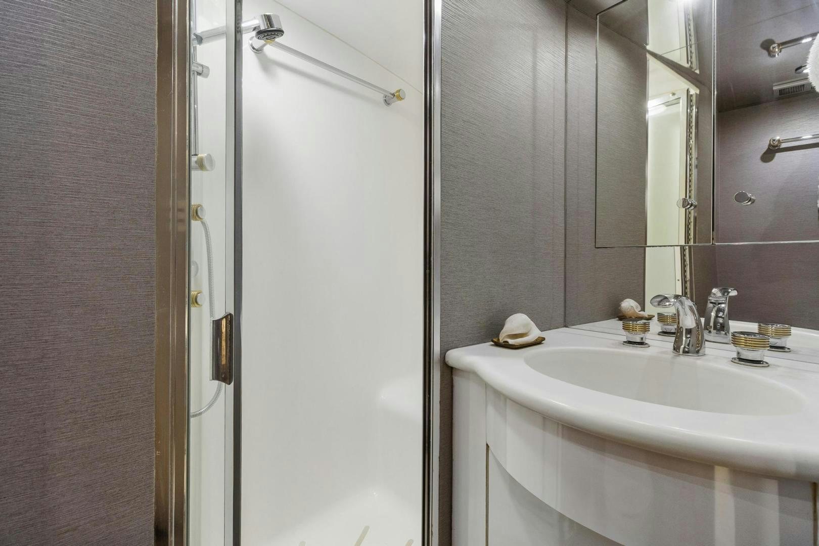 a bathroom with a sink and a mirror aboard BELLISSIMA Yacht for Sale