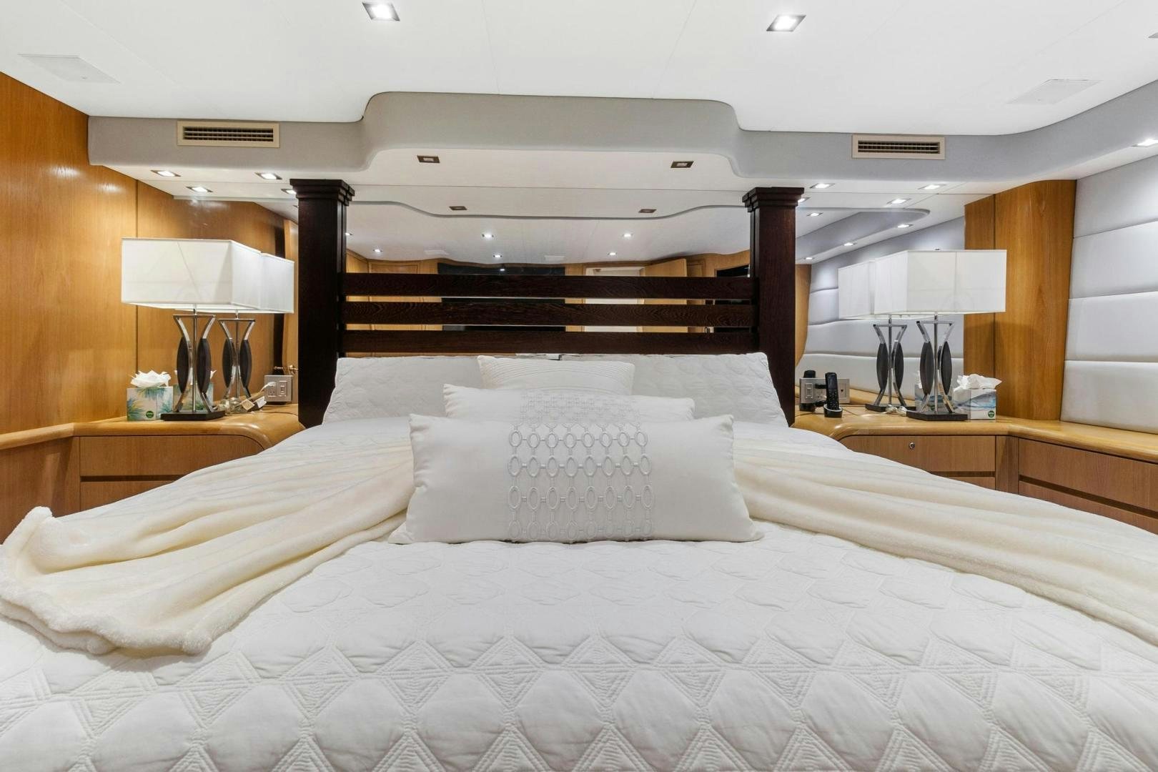 a bed with white sheets aboard BELLISSIMA Yacht for Sale